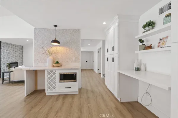 a view of a kitchen with furniture and fireplace