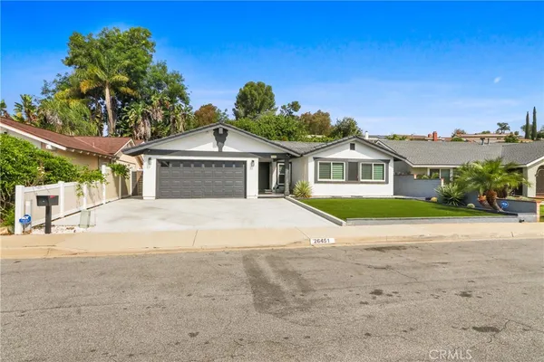 a house with yard in front of it