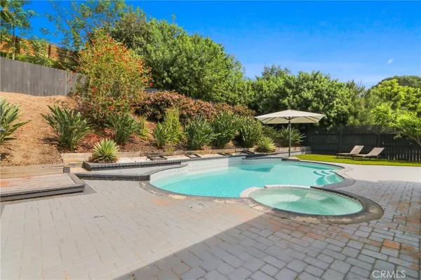 a view of a swimming pool with a patio