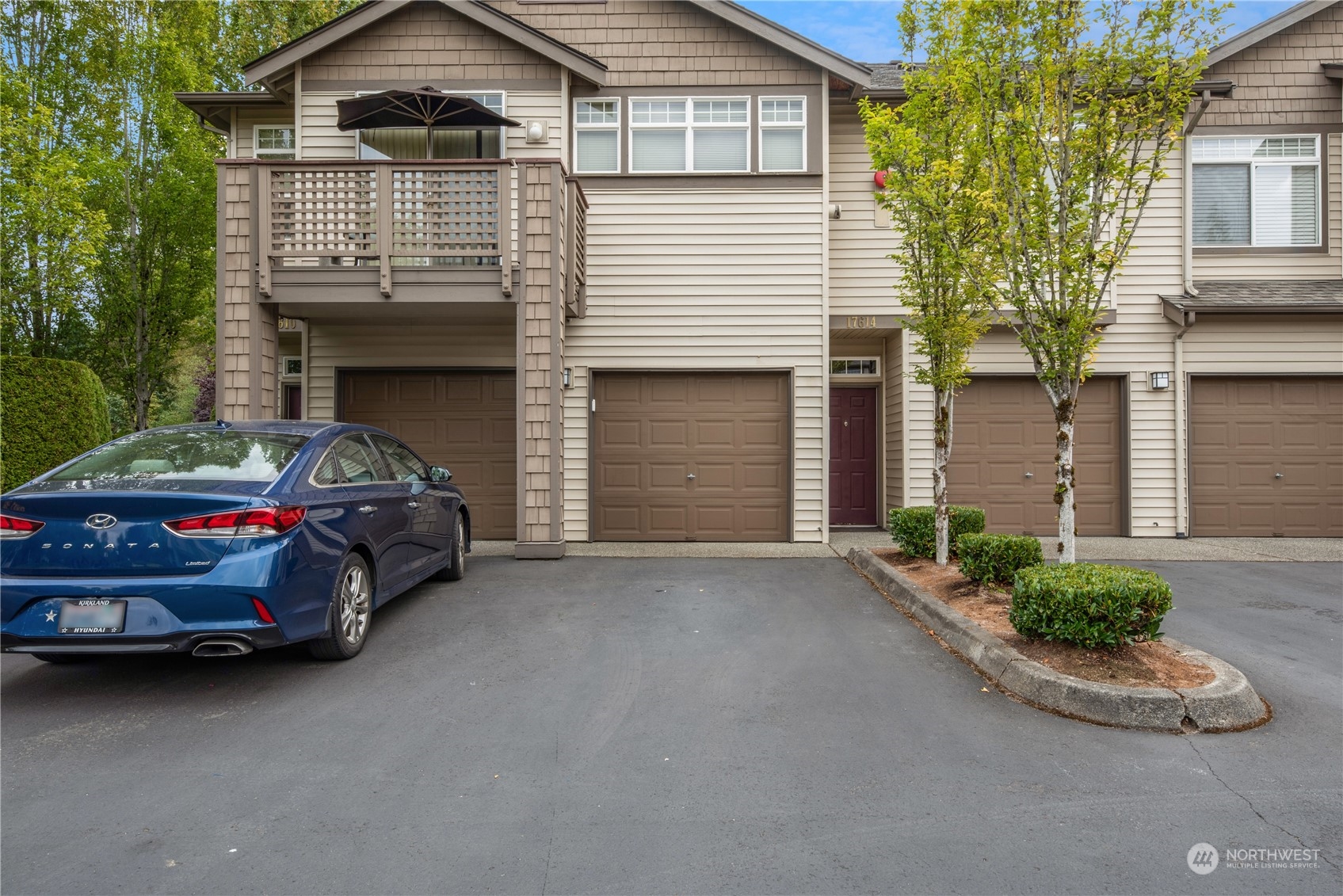 a car parked in front of white house