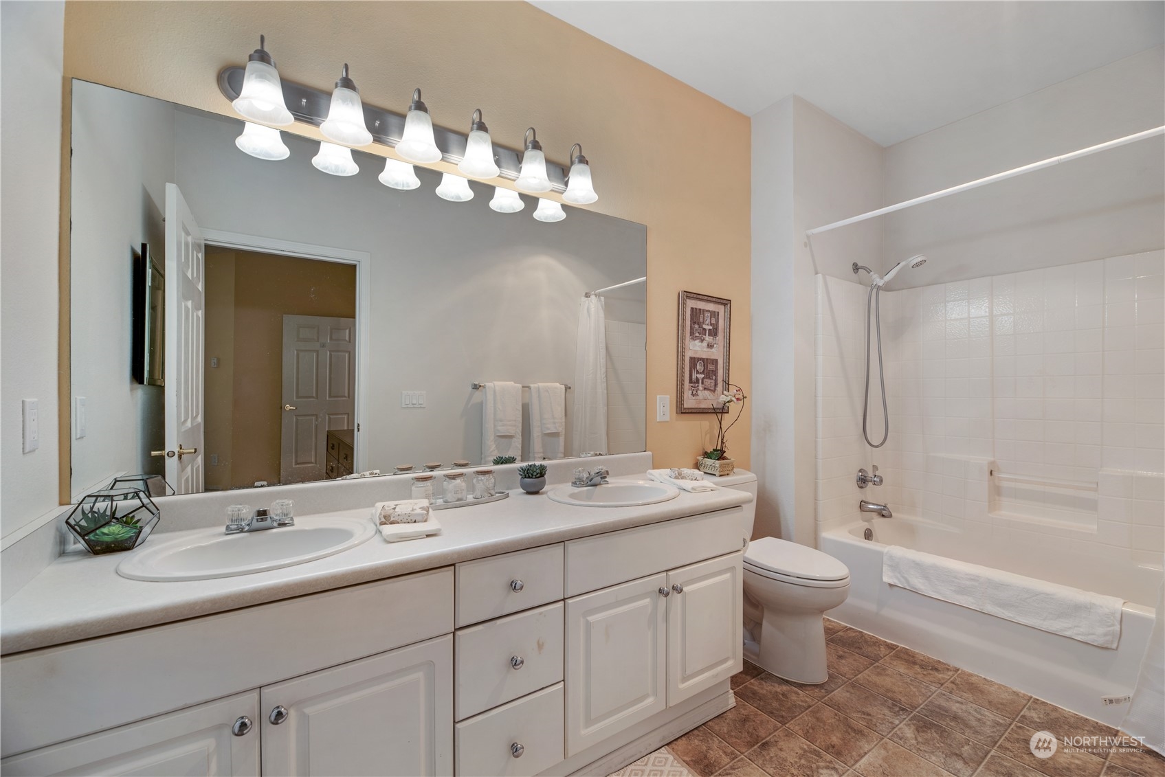 17604 134th Lane Southeast, Unit 17604 Renton, WA 98058 - Photo 12 of 25 a bathroom with a granite countertop sink a toilet and a bathtub