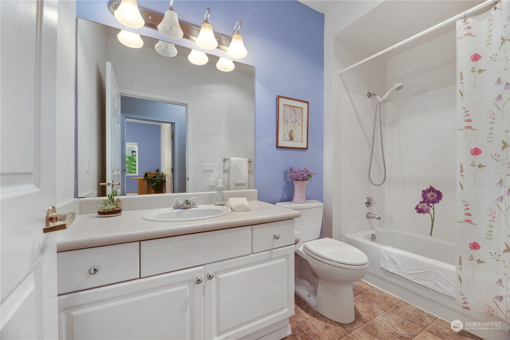 17604 134th Lane Southeast, Unit 17604 Renton, WA 98058 - Photo 14 of 25 a bathroom with a sink a toilet and a mirror