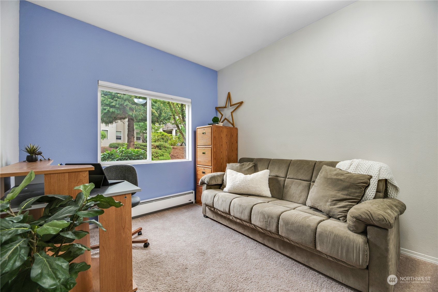 17604 134th Lane Southeast, Unit 17604 Renton, WA 98058 - Photo 15 of 25 a living room with furniture and a large window