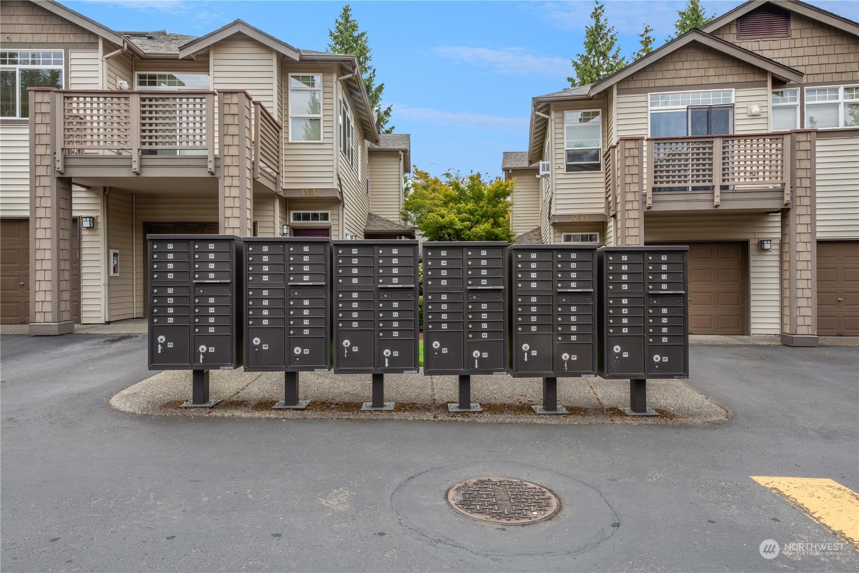 17604 134th Lane Southeast, Unit 17604 Renton, WA 98058 - Photo 20 of 25 a front view of a house with a garage
