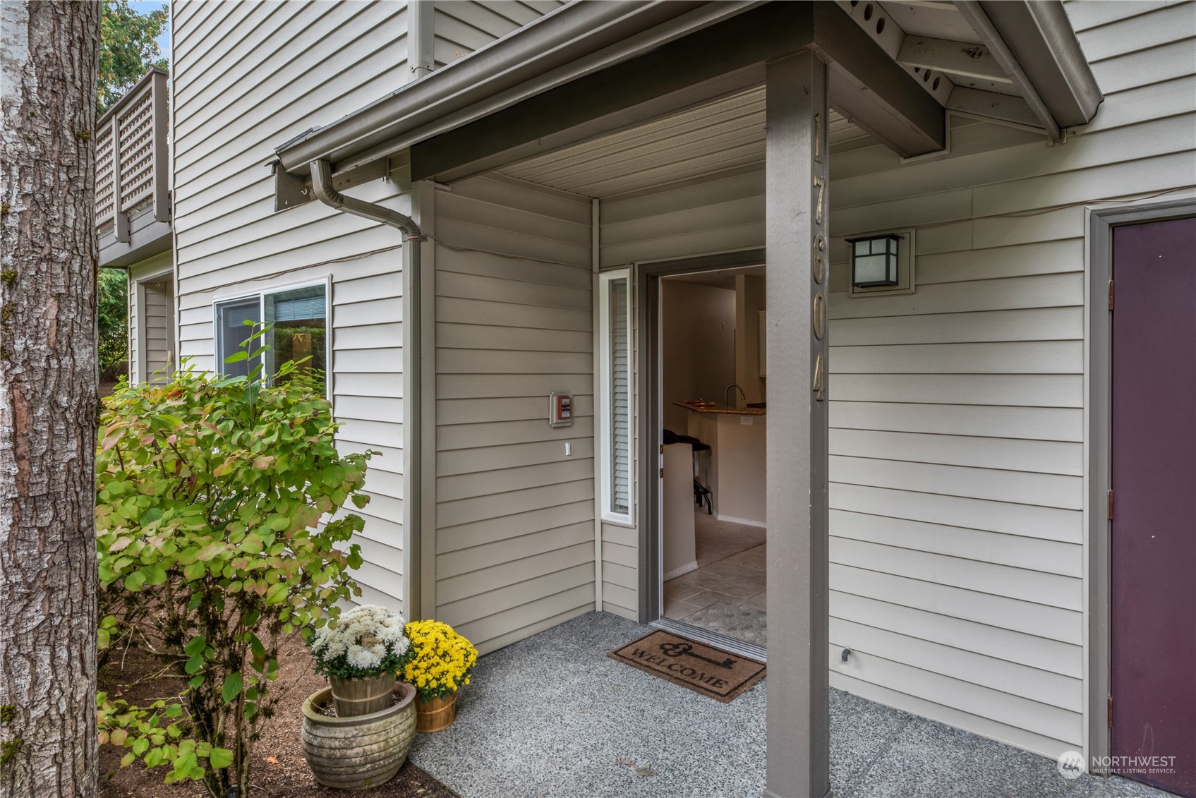 17604 134th Lane Southeast, Unit 17604 Renton, WA 98058 - Photo 2 of 25 a view of back door of the house
