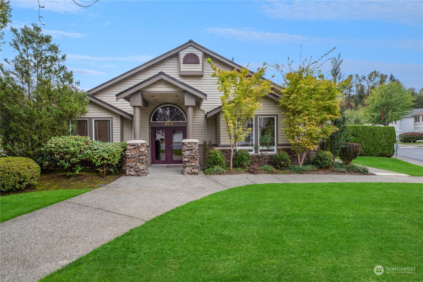 17604 134th Lane Southeast, Unit 17604 Renton, WA 98058 - Photo 21 of 25 a front view of a house with a yard
