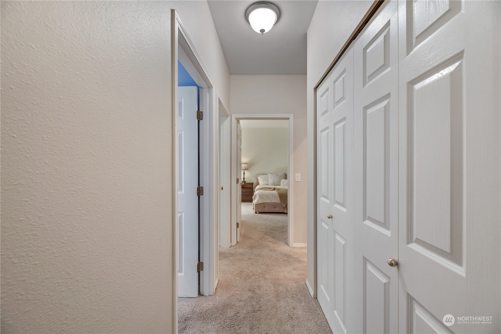 17604 134th Lane Southeast, Unit 17604 Renton, WA 98058 - Photo 8 of 25 a view of a hallway with a livingroom and a bathroom