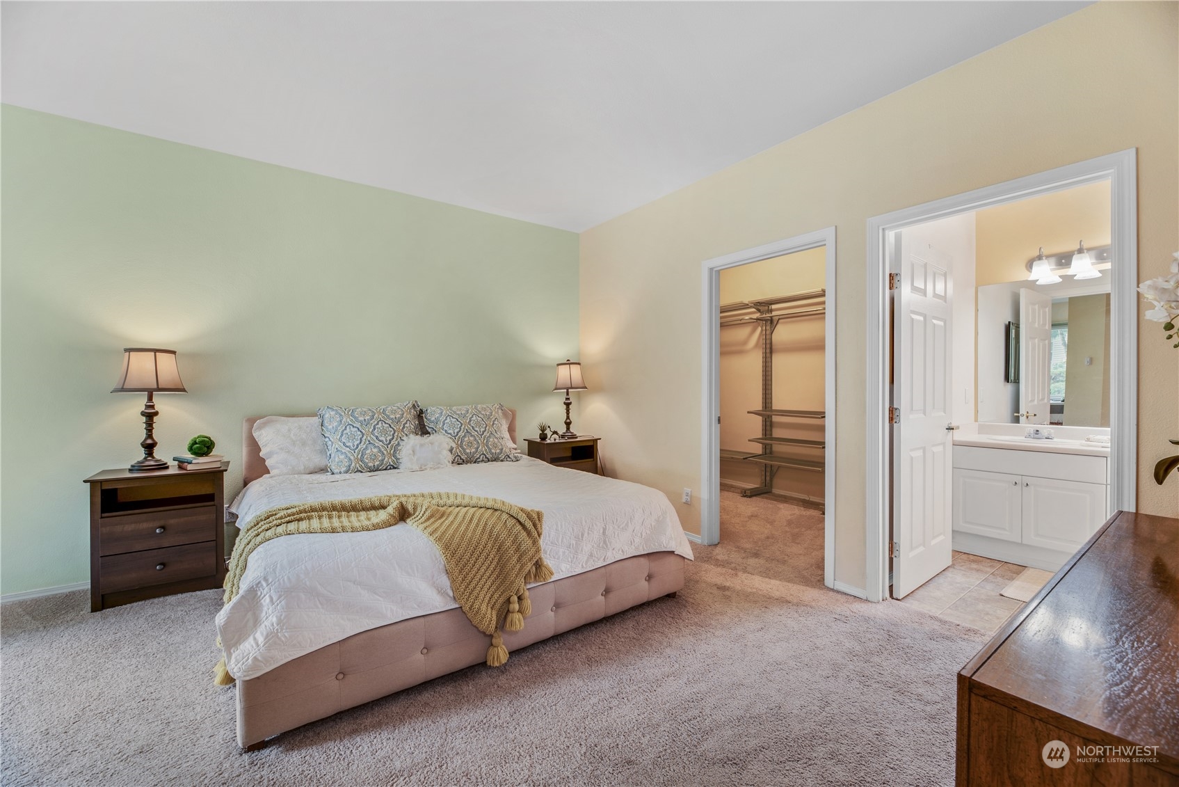 17604 134th Lane Southeast, Unit 17604 Renton, WA 98058 - Photo 9 of 25 a spacious bedroom with a bed and a view of bathroom