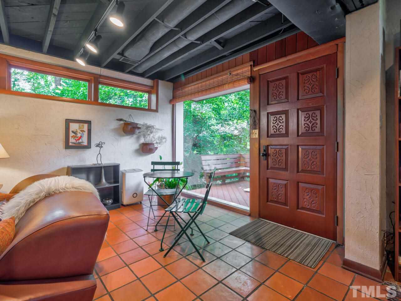 4512 Bartlett Street Raleigh, NC 27609 - Photo 19 of 30 Door leading from family room to the deck area