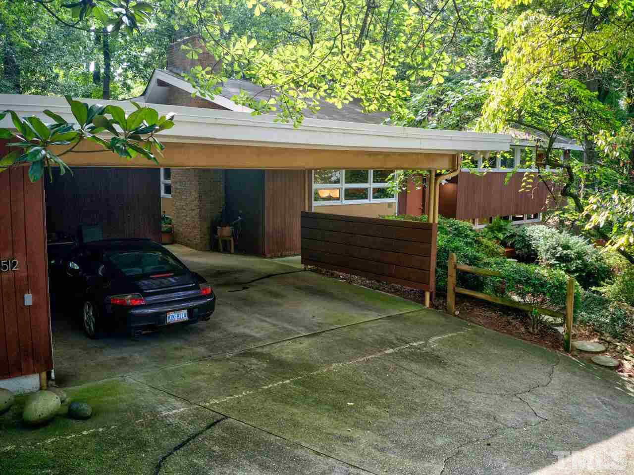 4512 Bartlett Street Raleigh, NC 27609 - Photo 27 of 30 The oversized double carport holds two cars and has 3 storage closets for lawn tools.