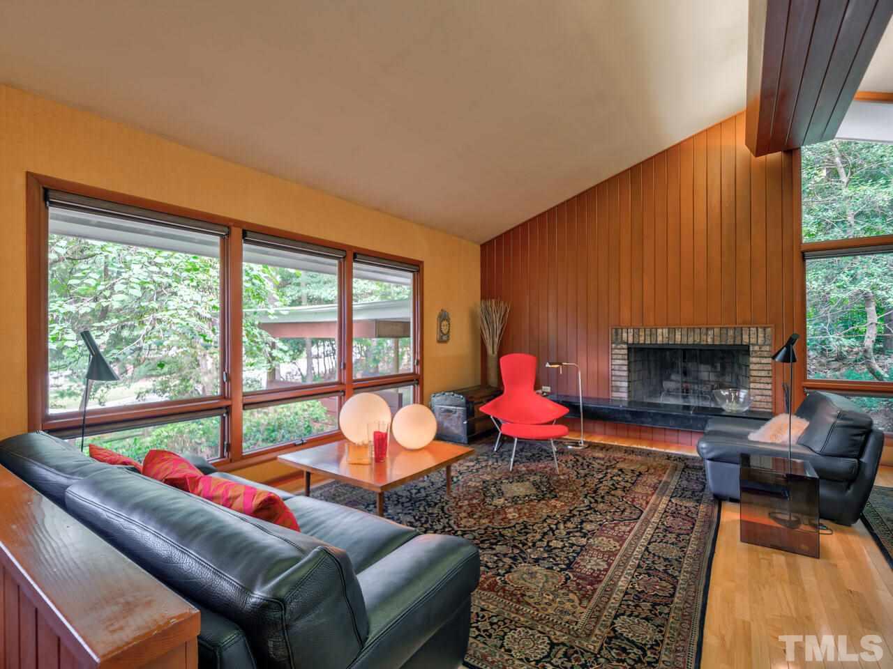 4512 Bartlett Street Raleigh, NC 27609 - Photo 4 of 30 Living room with raised hearth
