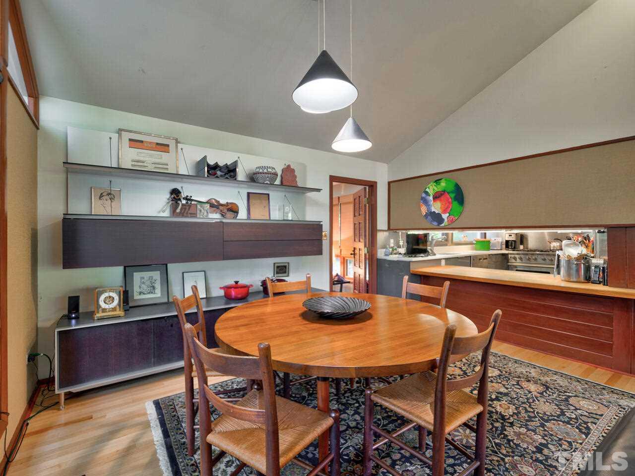 4512 Bartlett Street Raleigh, NC 27609 - Photo 6 of 30 Dining area with view of kitchen pass-through on right