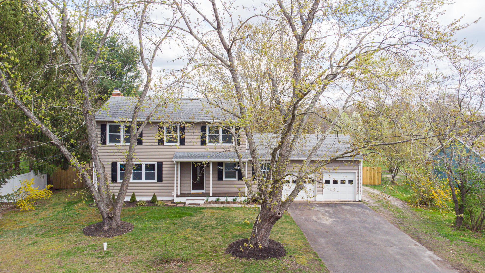 a front view of a house with a yard