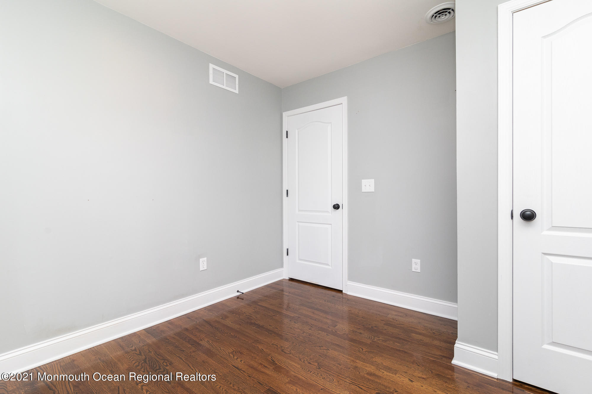 525 Frank Applegate Road Jackson, NJ 08527 - Photo 23 of 56 a view of an empty room with wooden floor