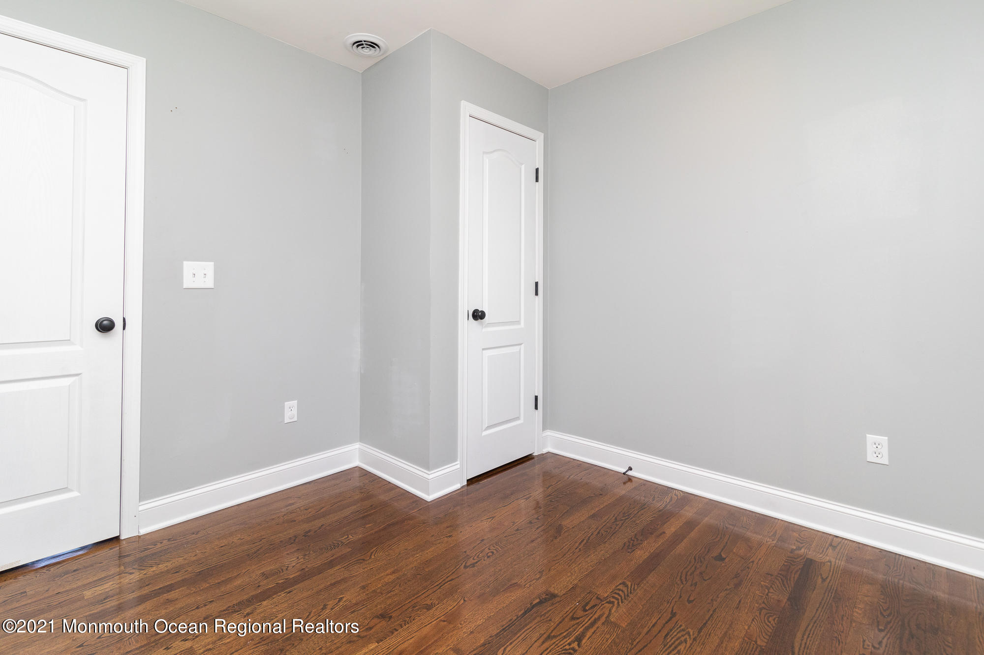 525 Frank Applegate Road Jackson, NJ 08527 - Photo 24 of 56 a view of an empty room with wooden floor