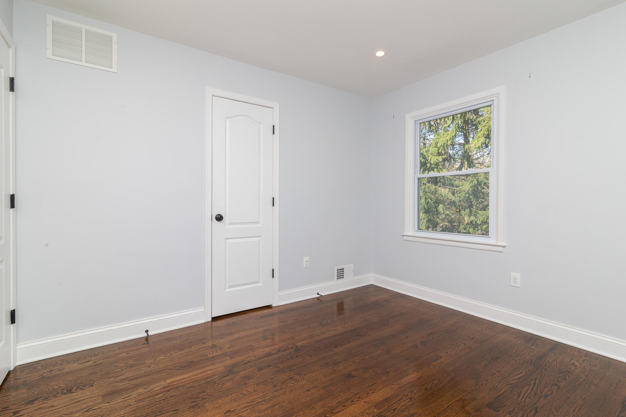 525 Frank Applegate Road Jackson, NJ 08527 - Photo 30 of 56 an empty room with wooden floor and window