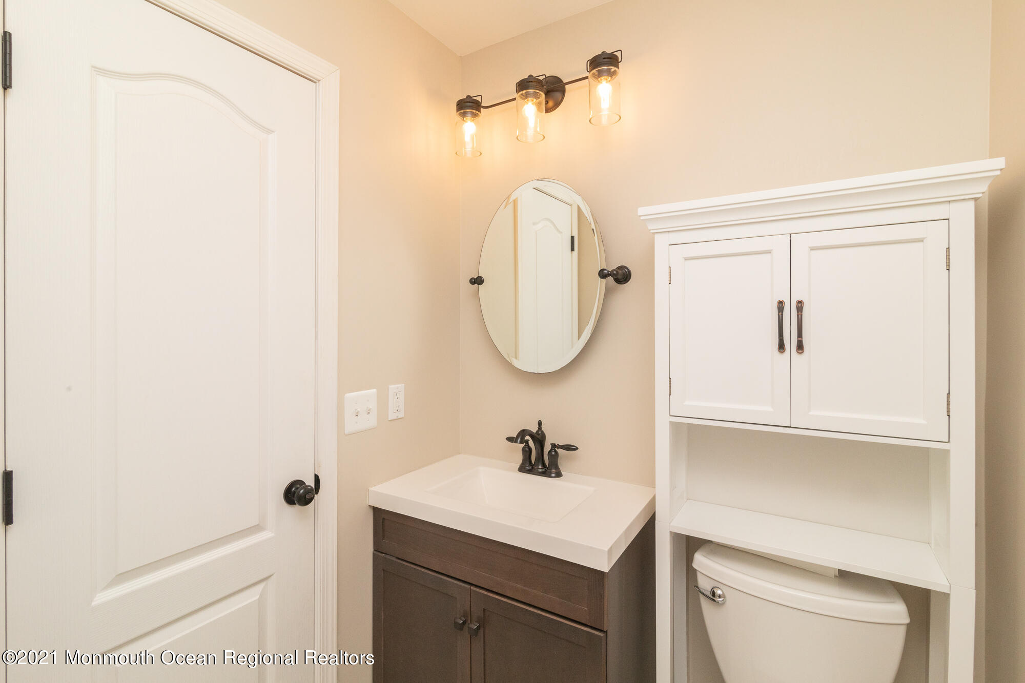 525 Frank Applegate Road Jackson, NJ 08527 - Photo 38 of 56 a bathroom with a sink a toilet and a mirror