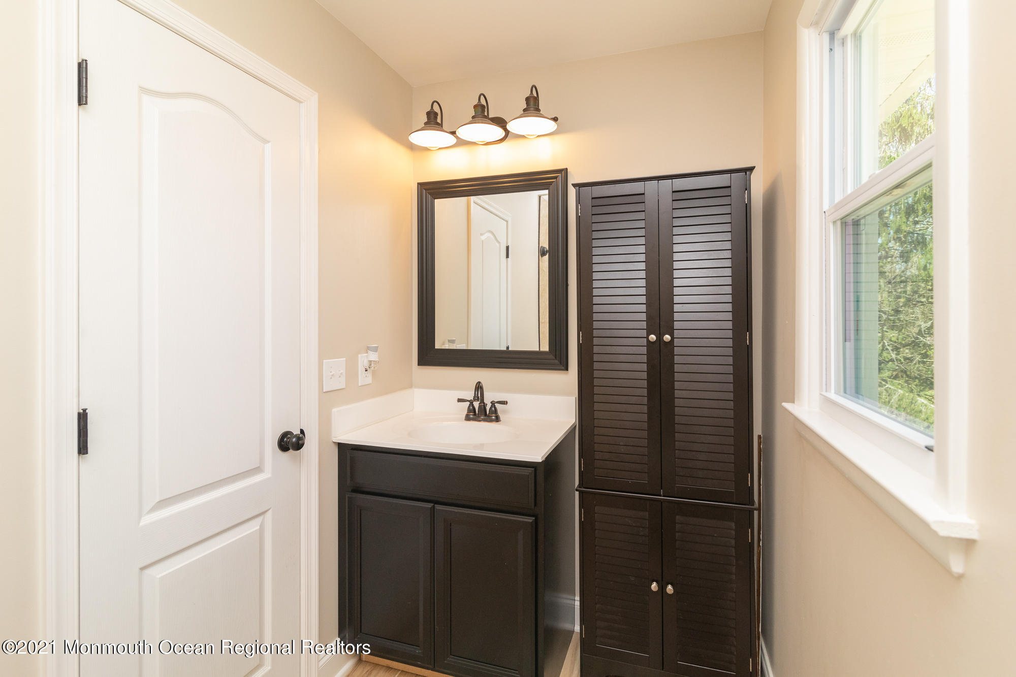 525 Frank Applegate Road Jackson, NJ 08527 - Photo 40 of 56 a bathroom with a sink and a mirror