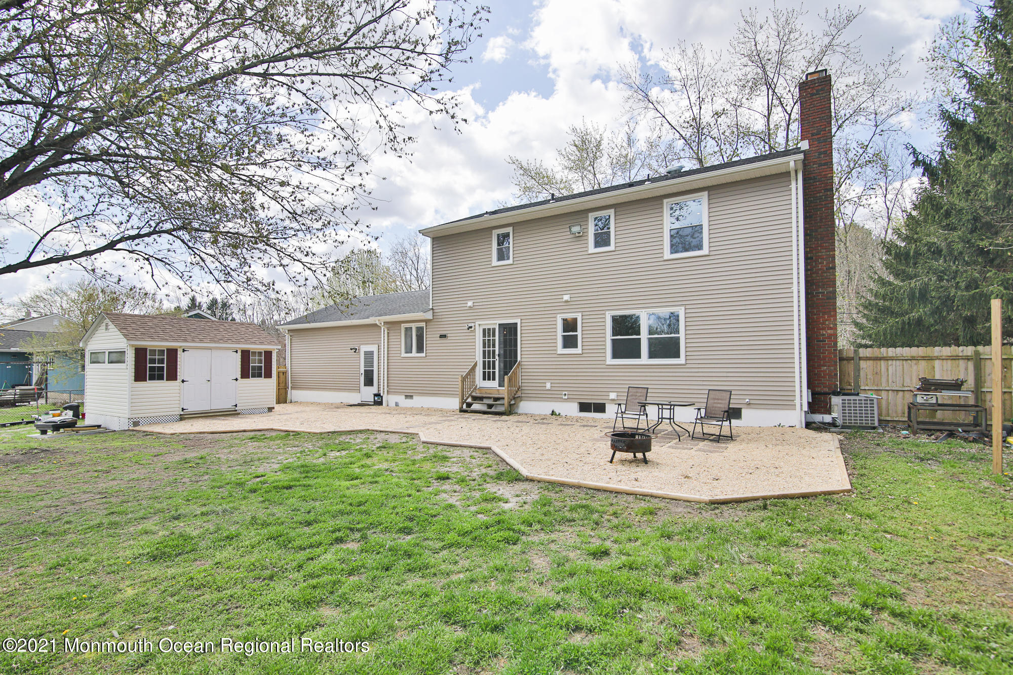 525 Frank Applegate Road Jackson, NJ 08527 - Photo 47 of 56 a backyard of a house with table and chairs