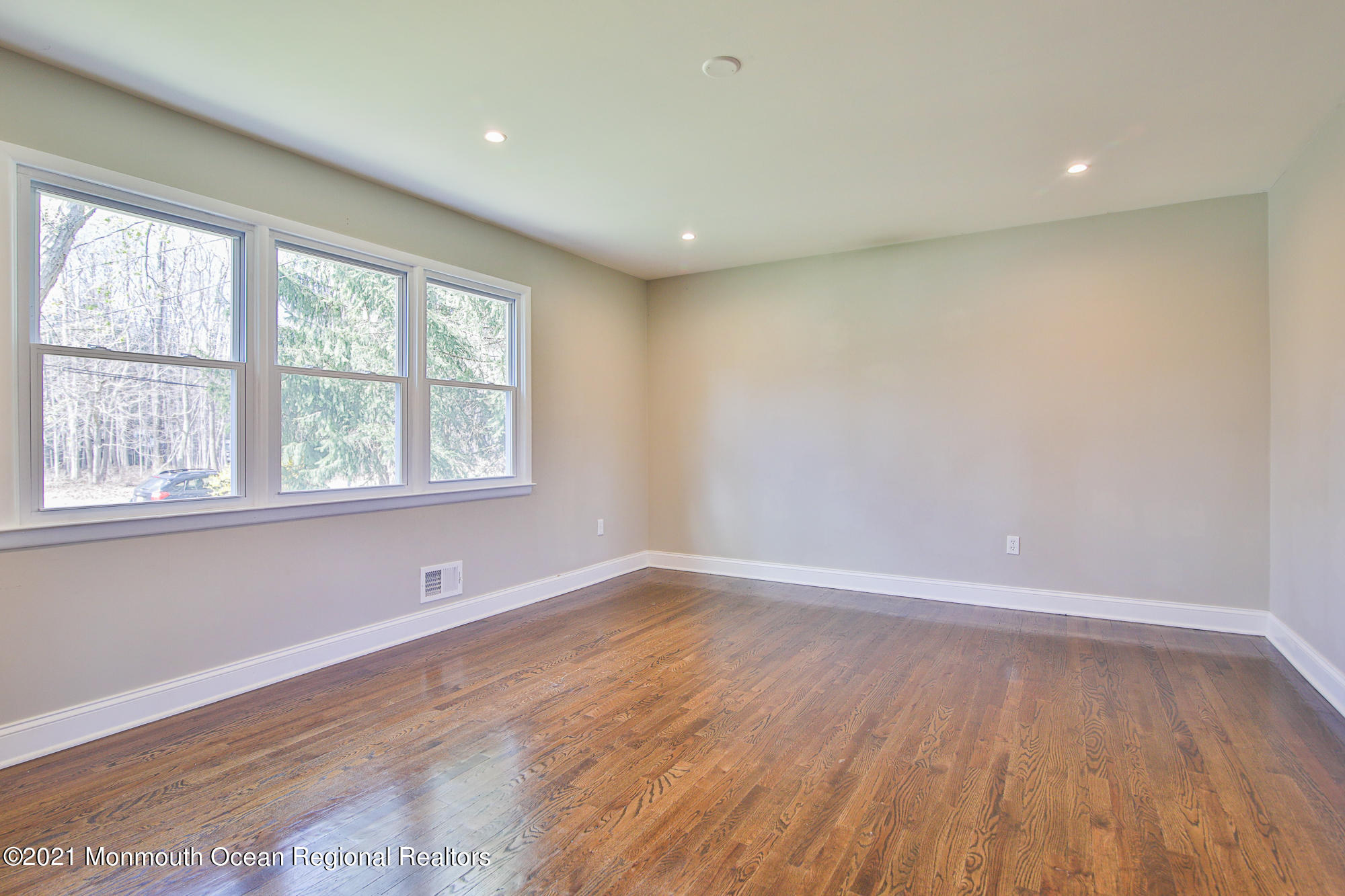 525 Frank Applegate Road Jackson, NJ 08527 - Photo 6 of 56 wooden floor in an empty room with a window