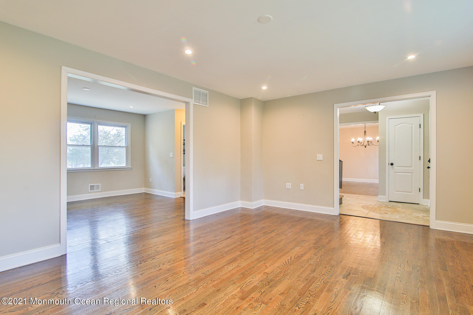 525 Frank Applegate Road Jackson, NJ 08527 - Photo 7 of 56 an empty room with wooden floor & windows and bathroom