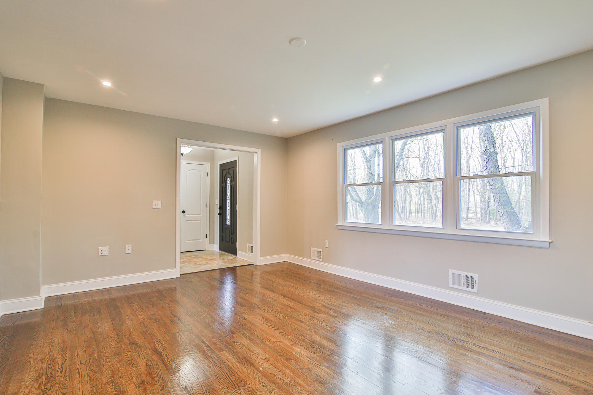 525 Frank Applegate Road Jackson, NJ 08527 - Photo 8 of 56 a view of an empty room with wooden floor and a window