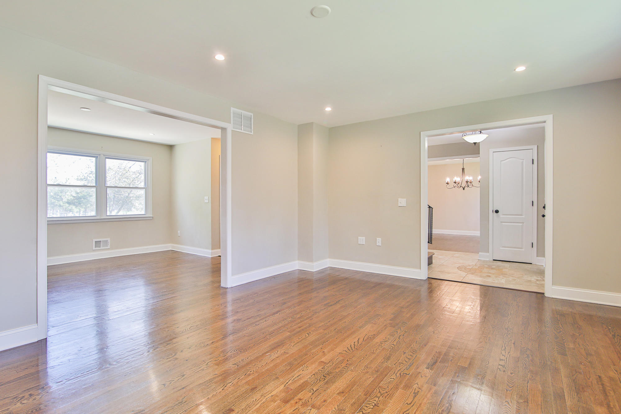 525 Frank Applegate Road Jackson, NJ 08527 - Photo 9 of 56 an empty room with wooden floor and windows