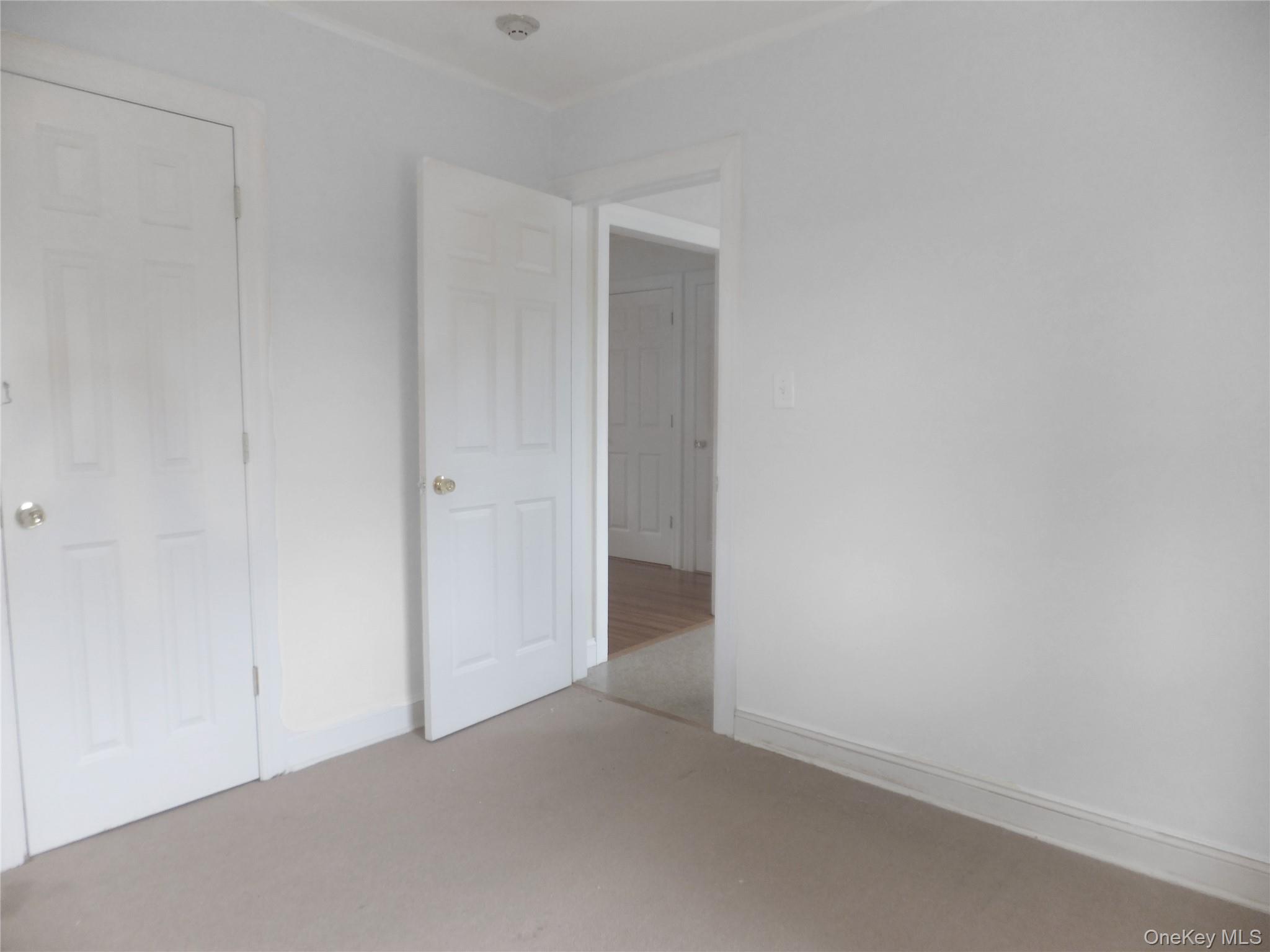 107 Kensington Road, Unit 5 Bronxville, NY 10708 - Photo 6 of 17 Unfurnished bedroom featuring carpet and baseboards