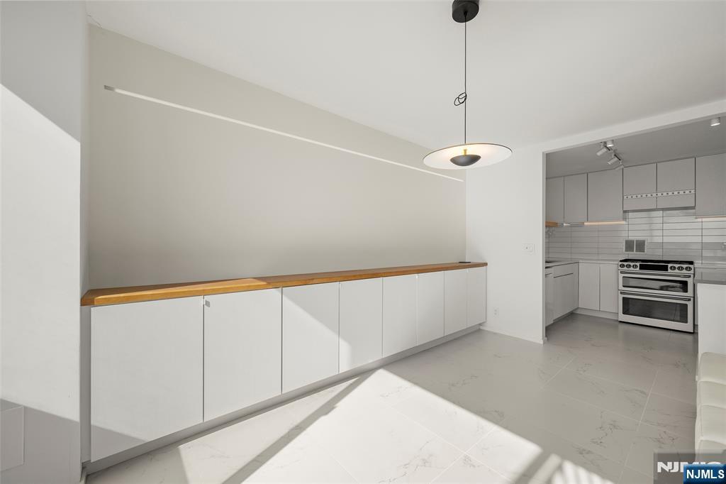 200 Old Palisade Road, Unit 25D Fort Lee, NJ 07024 - Photo 11 of 30 a view of a kitchen with microwave and cabinets