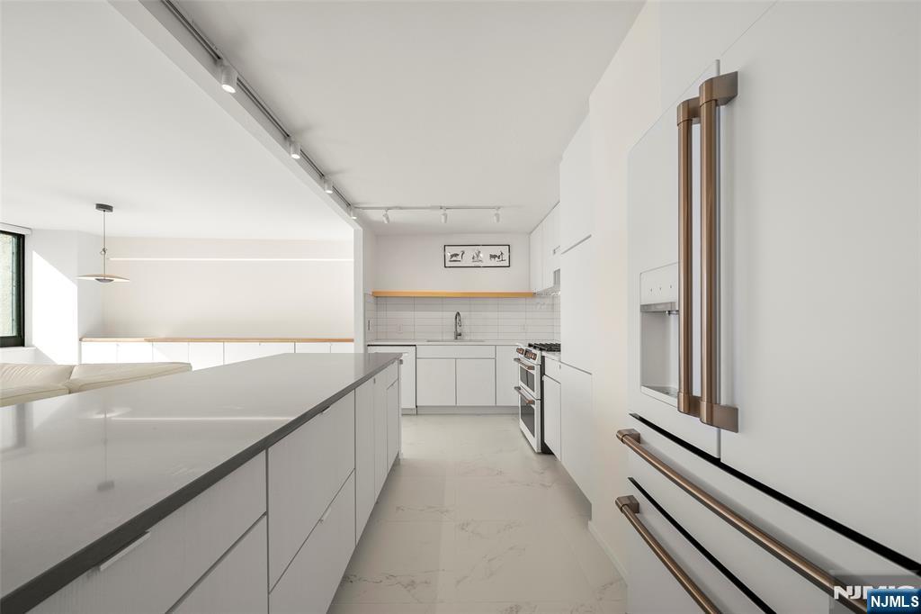 200 Old Palisade Road, Unit 25D Fort Lee, NJ 07024 - Photo 12 of 30 a view of a kitchen with two windows