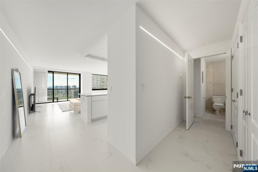 200 Old Palisade Road, Unit 25D Fort Lee, NJ 07024 - Photo 16 of 30 a view of a hallway with a living room