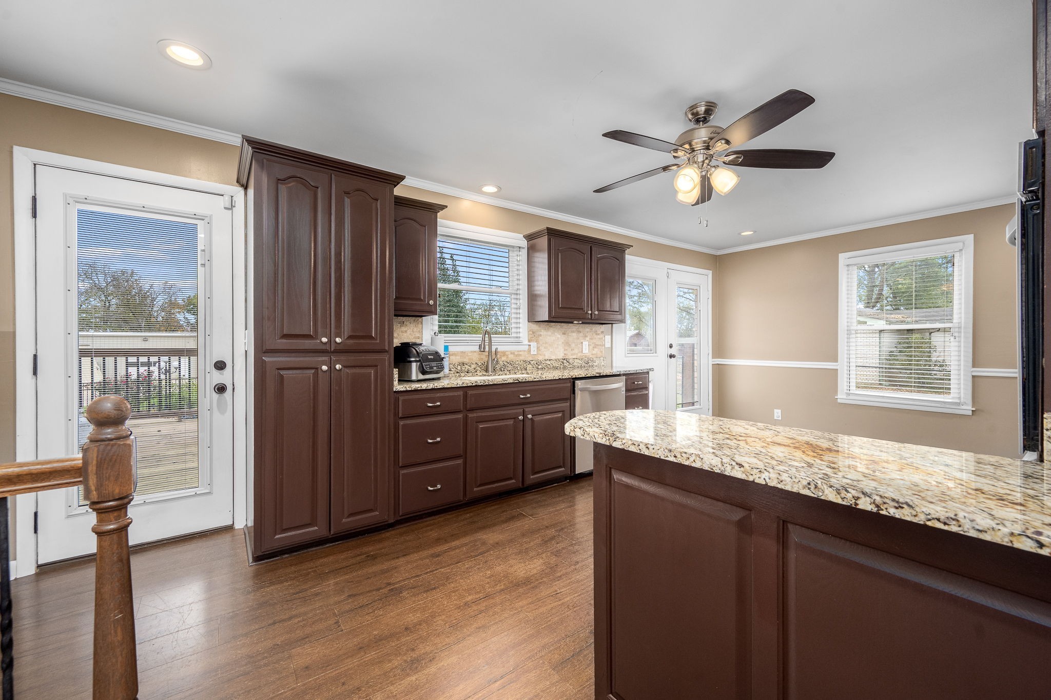 6580 Burkitt Road Antioch, TN 37013 - Photo 15 of 62 a kitchen with granite countertop cabinets stainless steel appliances a sink and a window