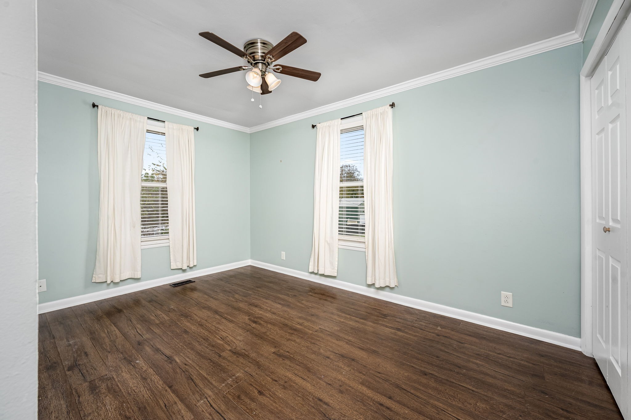 6580 Burkitt Road Antioch, TN 37013 - Photo 17 of 62 a view of a livingroom with a ceiling fan and wooden floor