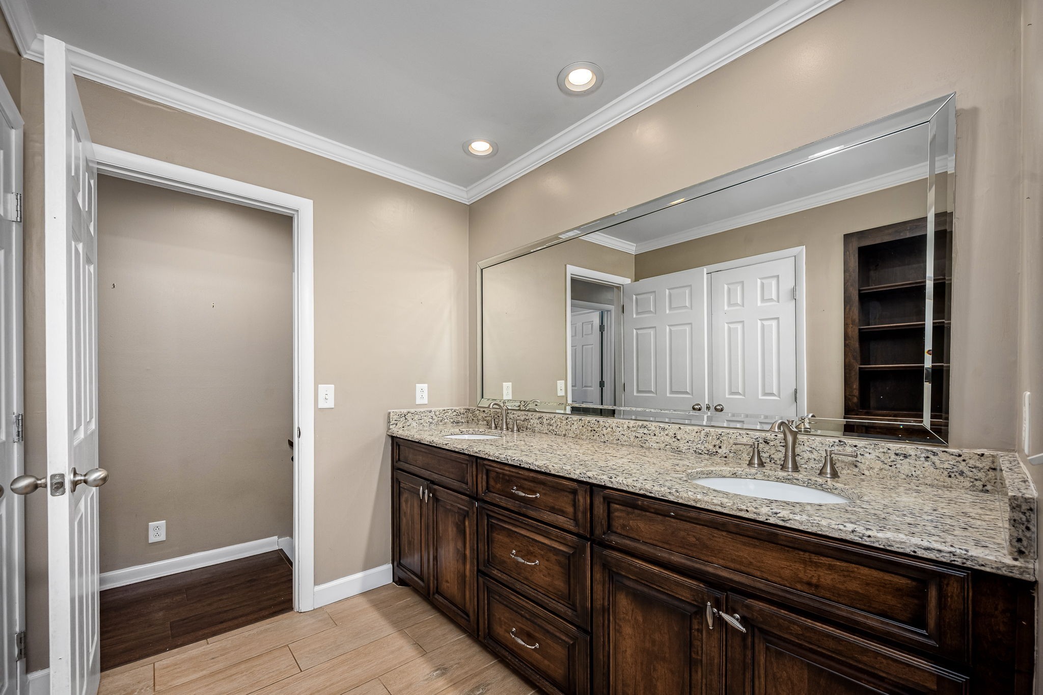 6580 Burkitt Road Antioch, TN 37013 - Photo 21 of 62 a bathroom with a granite countertop sink and a mirror