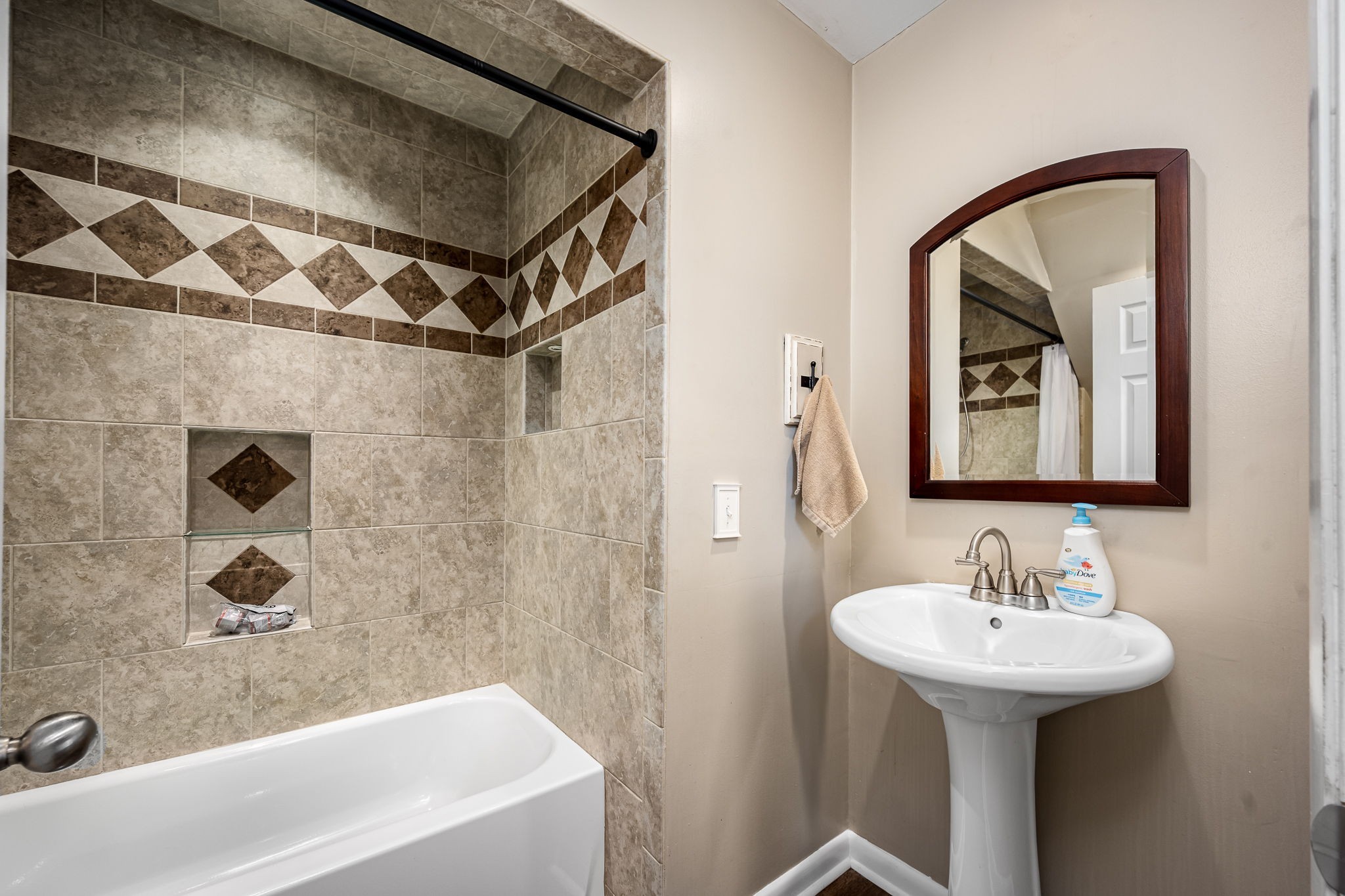 6580 Burkitt Road Antioch, TN 37013 - Photo 24 of 62 a bathroom with a sink and a mirror