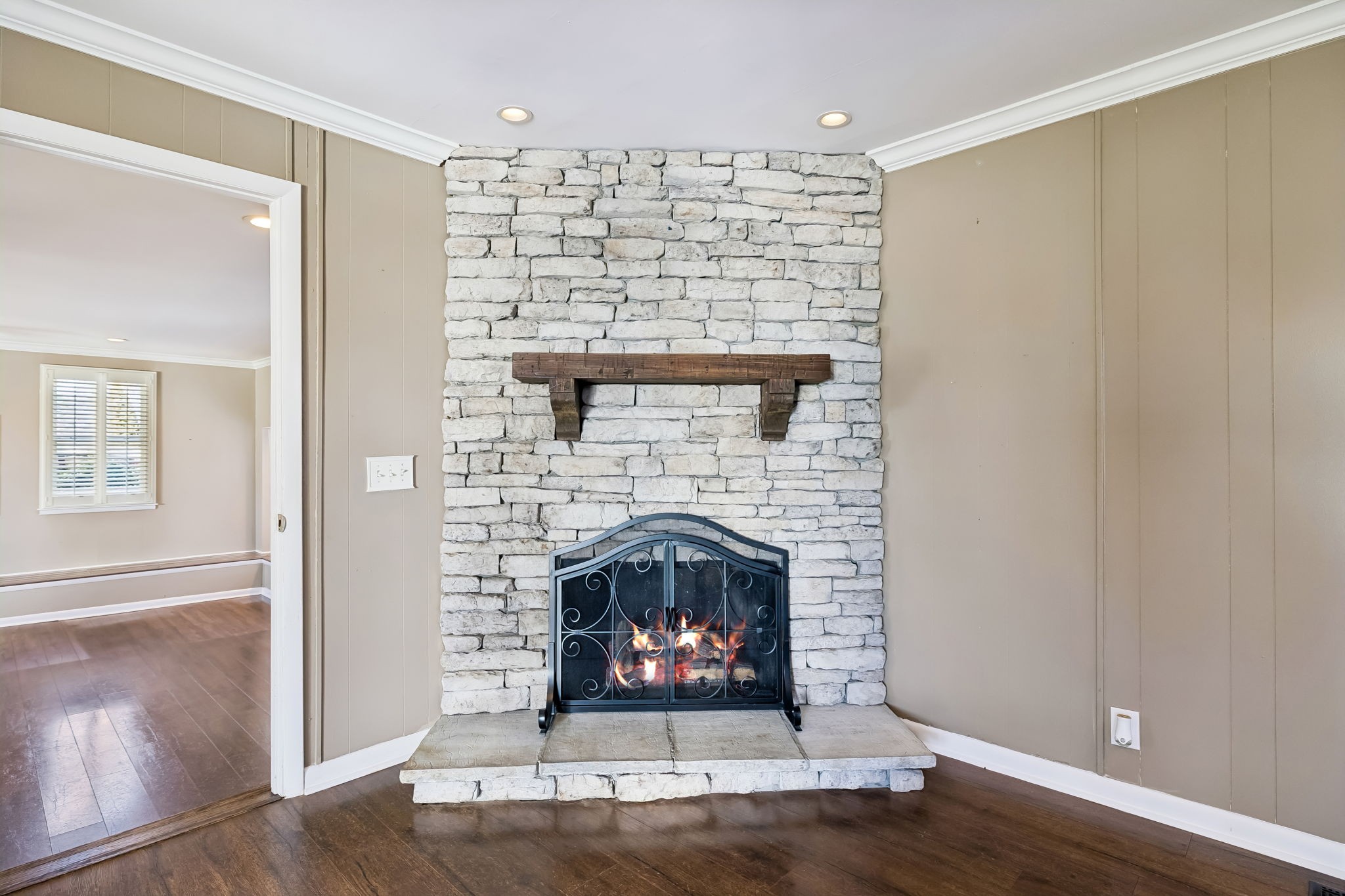 6580 Burkitt Road Antioch, TN 37013 - Photo 27 of 62 a living room with a fireplace and wooden floor