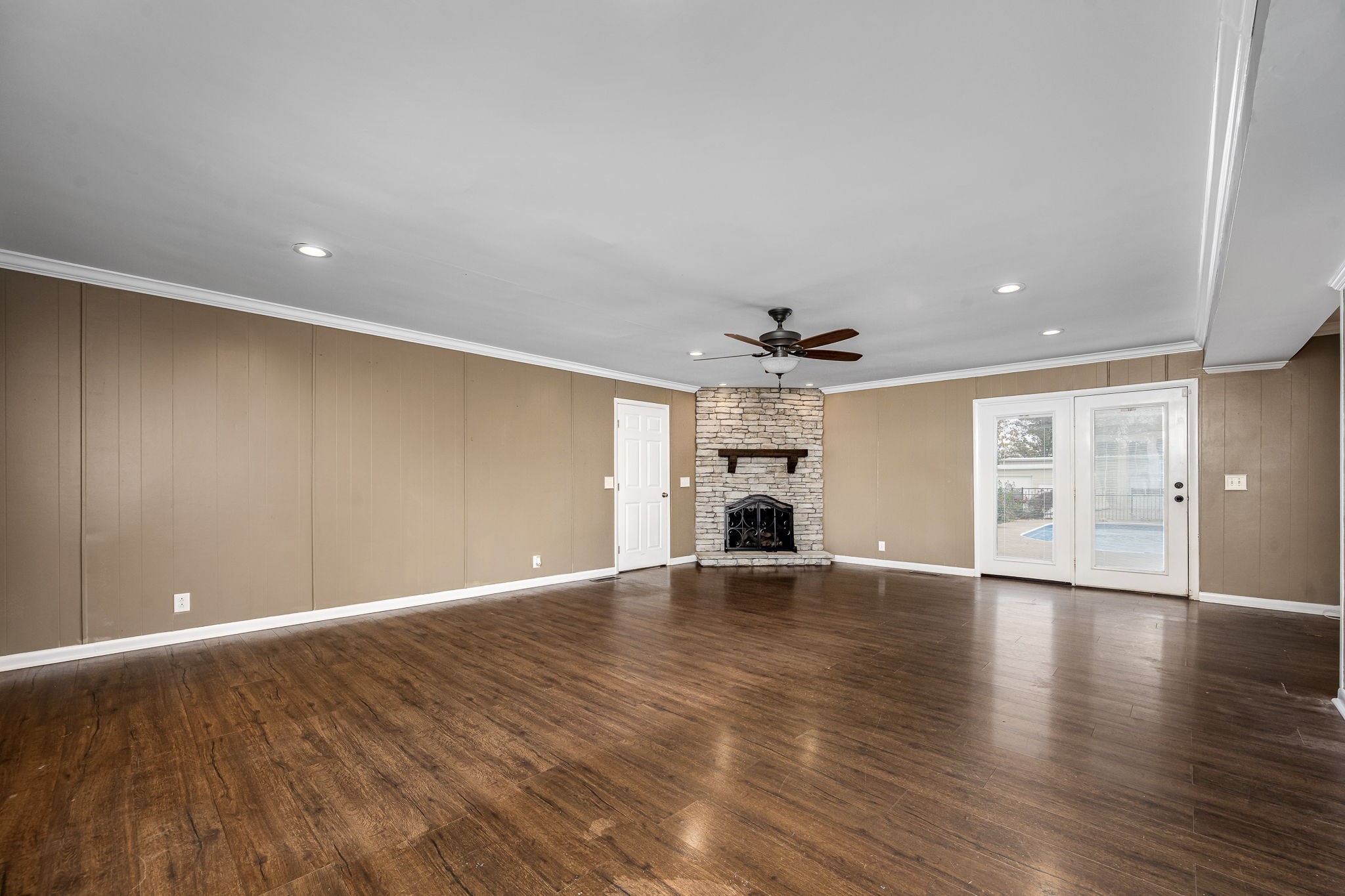6580 Burkitt Road Antioch, TN 37013 - Photo 29 of 62 a view of an empty room with a window and wooden floor