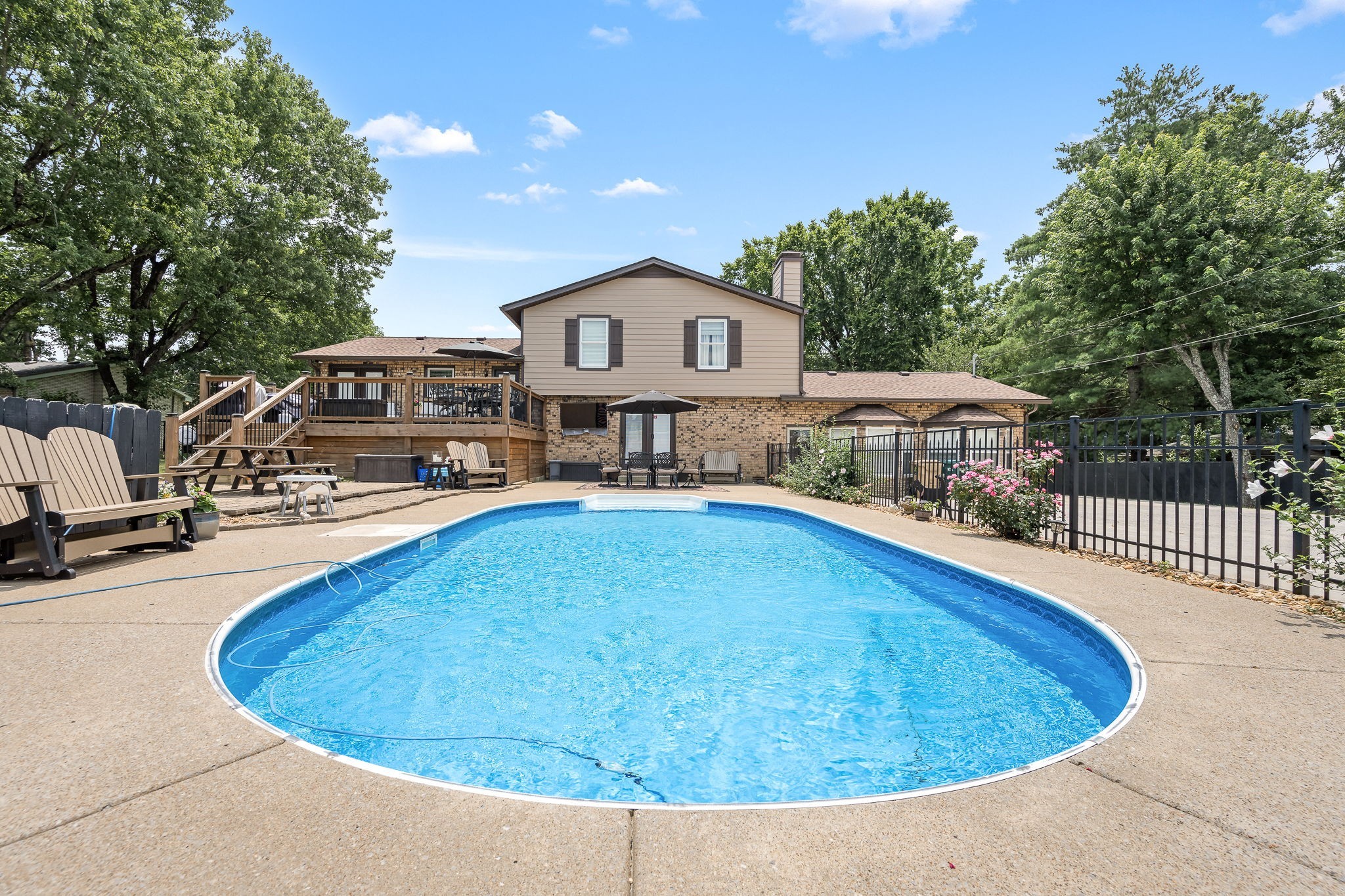 6580 Burkitt Road Antioch, TN 37013 - Photo 37 of 62 a swimming pool with outdoor seating and yard