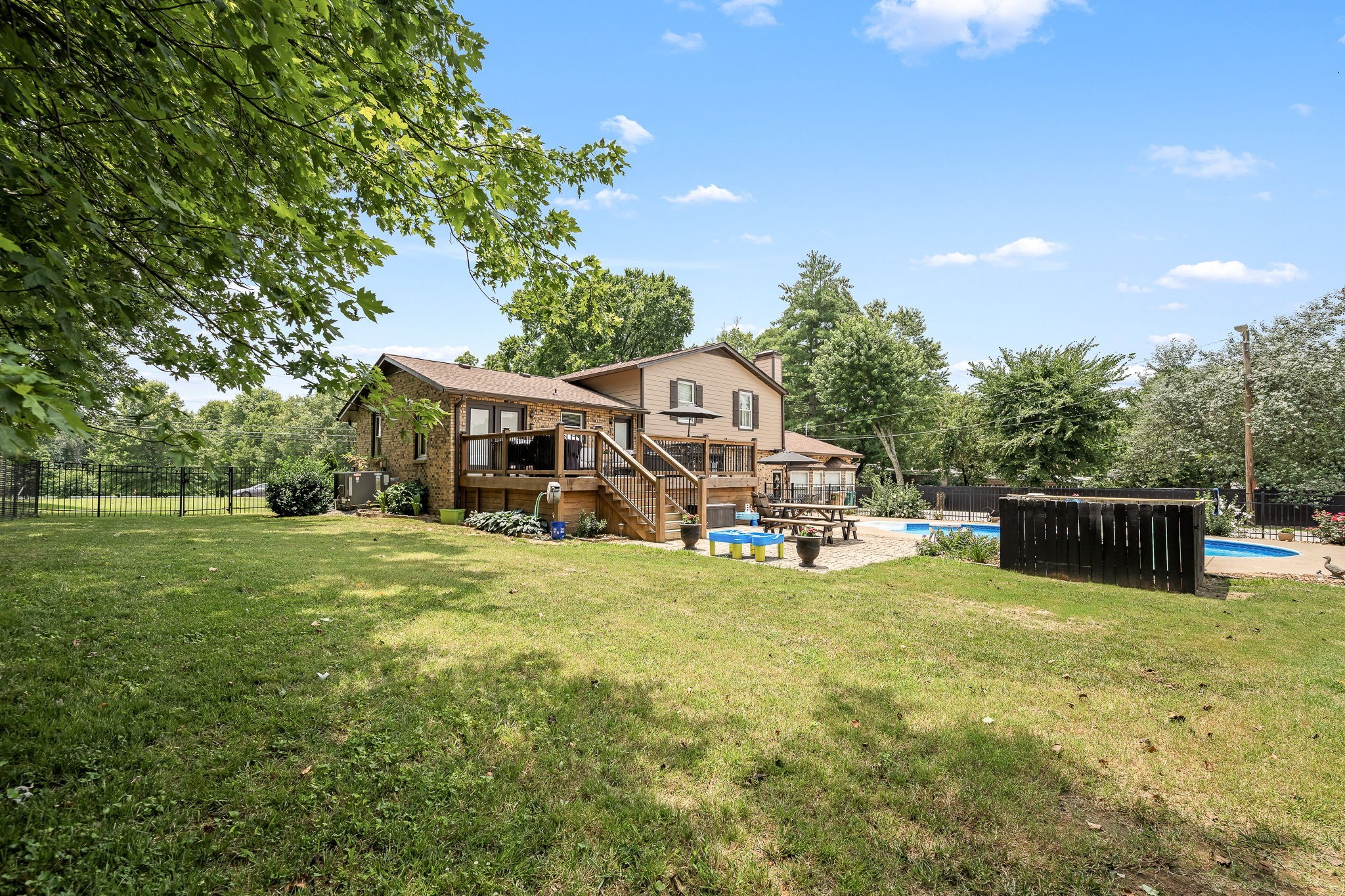 6580 Burkitt Road Antioch, TN 37013 - Photo 38 of 62 a view of a house with a big yard and sitting area