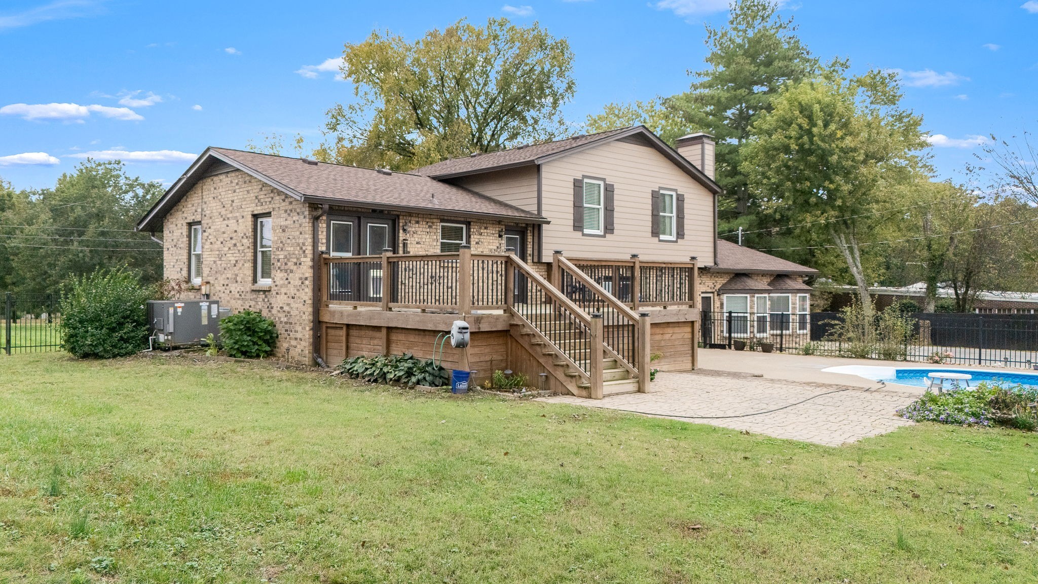 6580 Burkitt Road Antioch, TN 37013 - Photo 57 of 62 a white house that has a tree in front of it