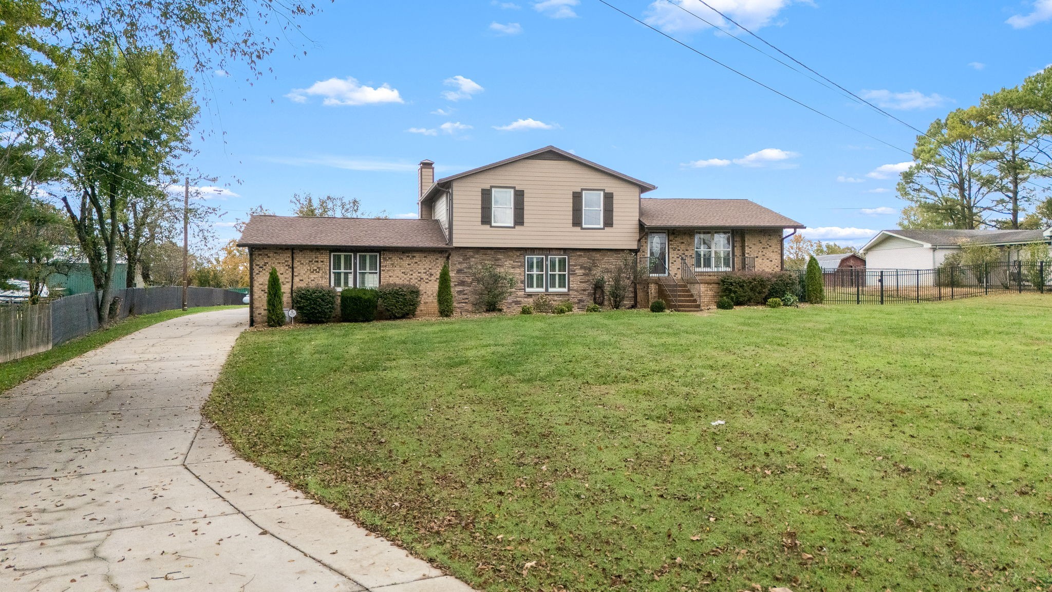 6580 Burkitt Road Antioch, TN 37013 - Photo 58 of 62 a front view of a house with a yard and garage