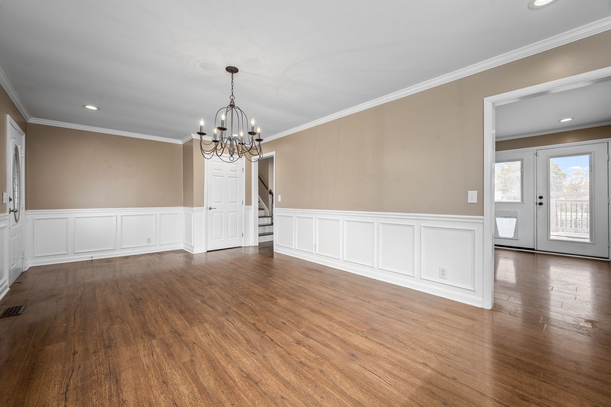 6580 Burkitt Road Antioch, TN 37013 - Photo 8 of 62 a view of a livingroom with wooden floor staircase and a kitchen space