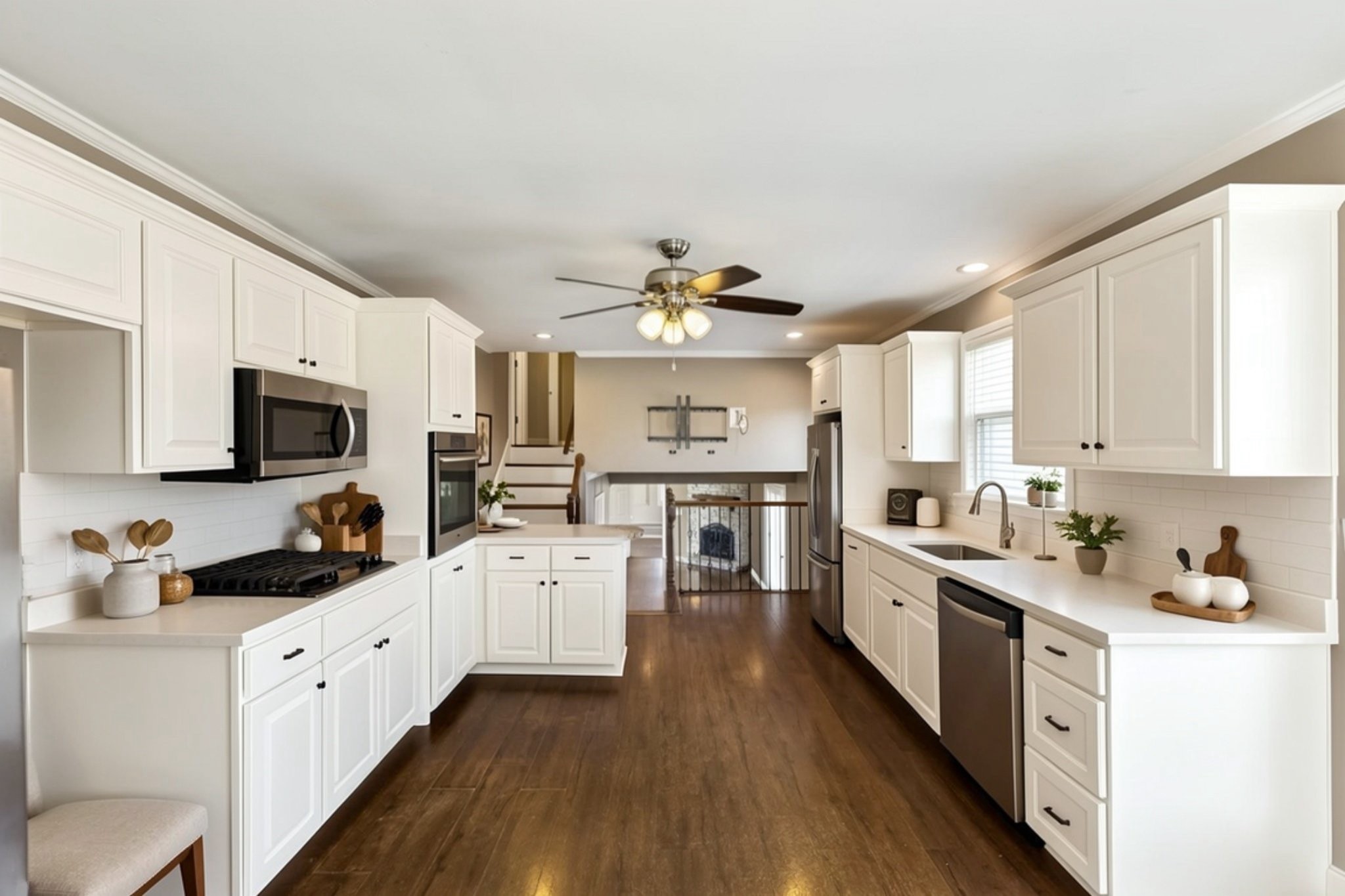 6580 Burkitt Road Antioch, TN 37013 - Photo 10 of 62 a kitchen with stainless steel appliances a white stove top oven a sink dishwasher and a refrigerator with wooden floor