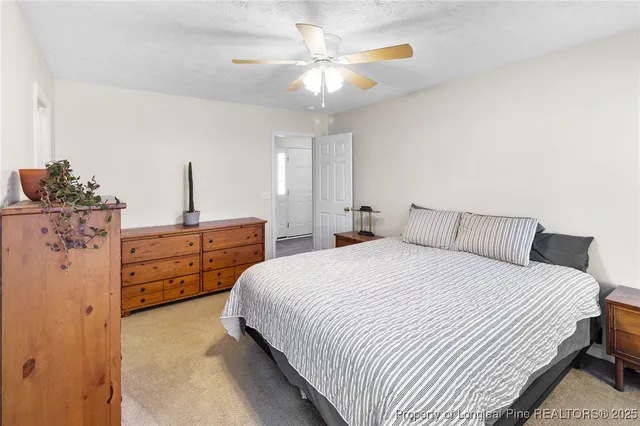 a bedroom with bed and window