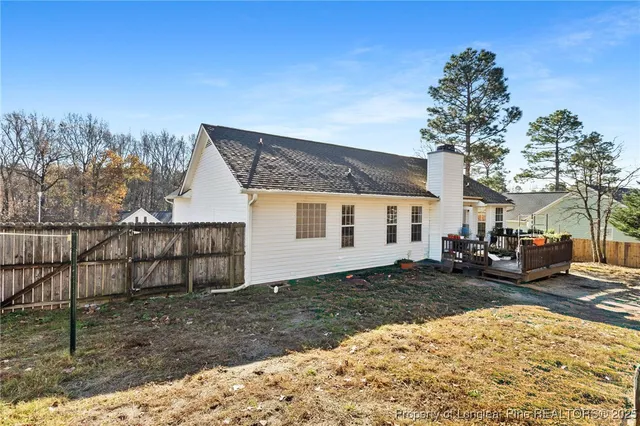 a view of a house with a snow in the yard