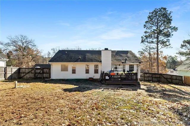 a view of a house with a yard covered in snow