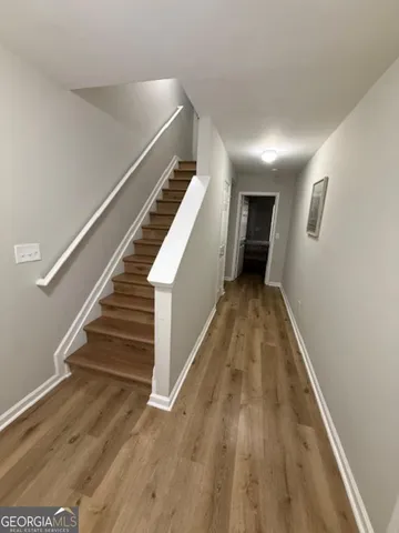 a bedroom with a large bed and a dresser