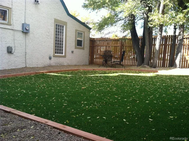 a backyard of a house with lots of green space
