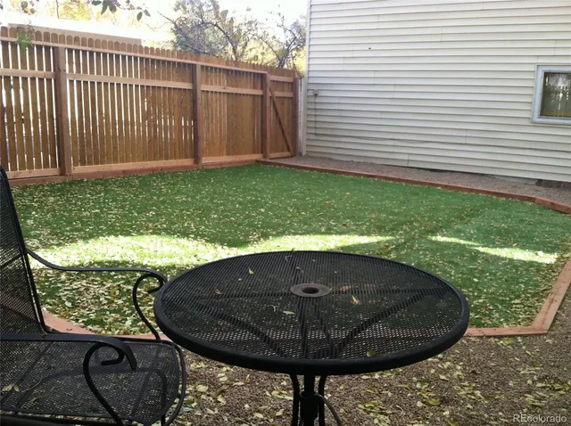 a view of a backyard with a tub
