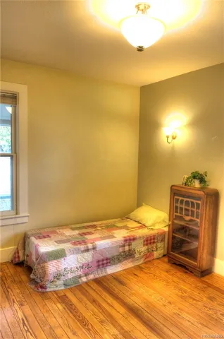 a view of walk in closet and bedroom